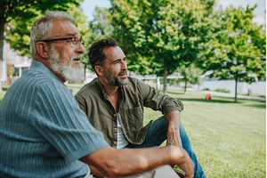 Happy dad and adult son enjoying, a Person Photo by HalfPoint