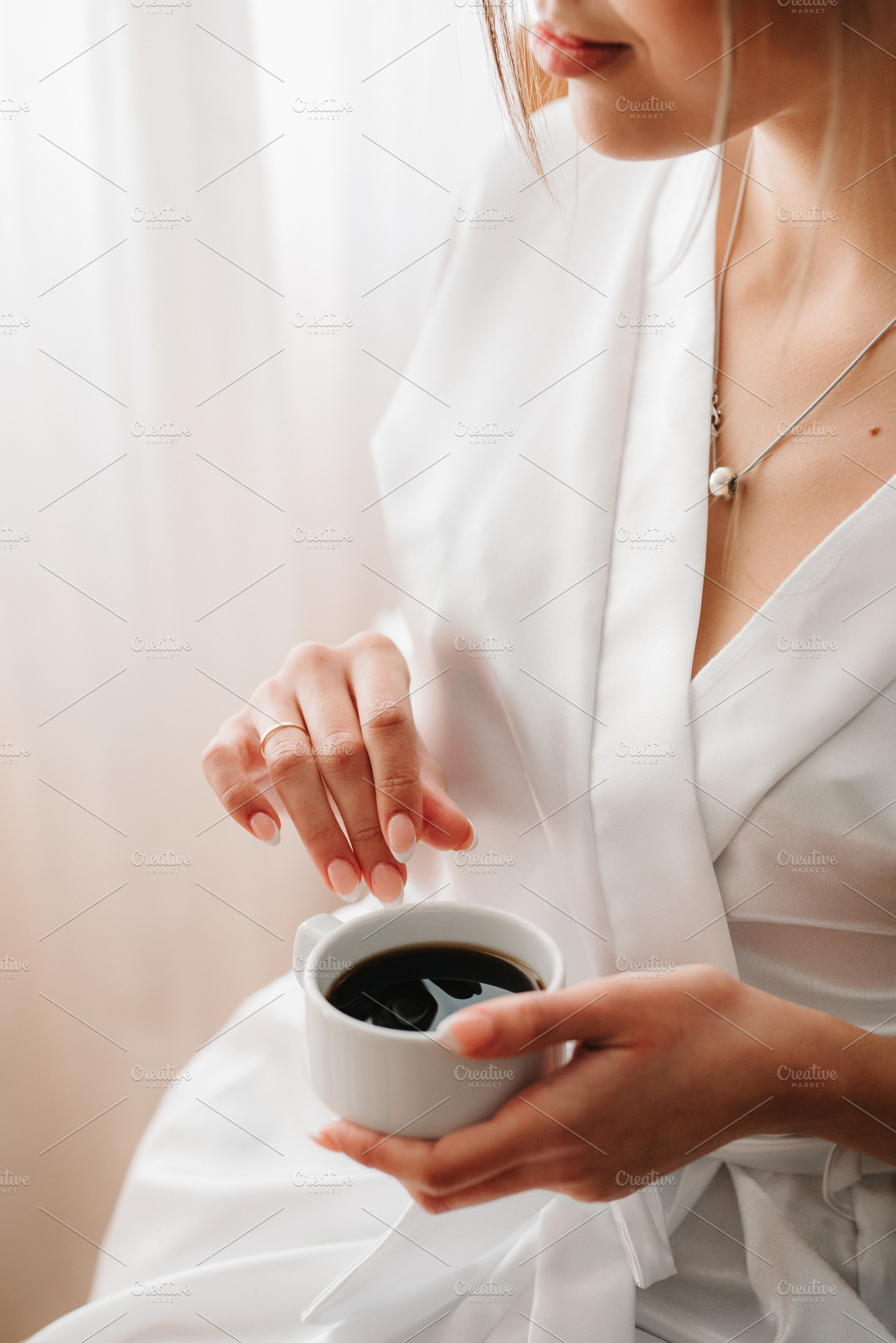 A young bride sits at a slot machine in the morning and drinks c, a Person Photo by Weddings, People, Travel