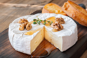 Creamy Camembert Cheese With Maple Syrup Walnuts And Toasted Bag, a Food & Drink Photo by Alexander Prokopenko