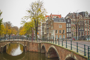 Historic brick bridges over Amsterdam canals in autumn, vertical, a Photo by Pictures for you!!!!!!!!!