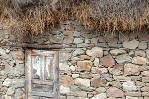 A roughly made door in a stone wall, an Architecture Photo by Schreibikus