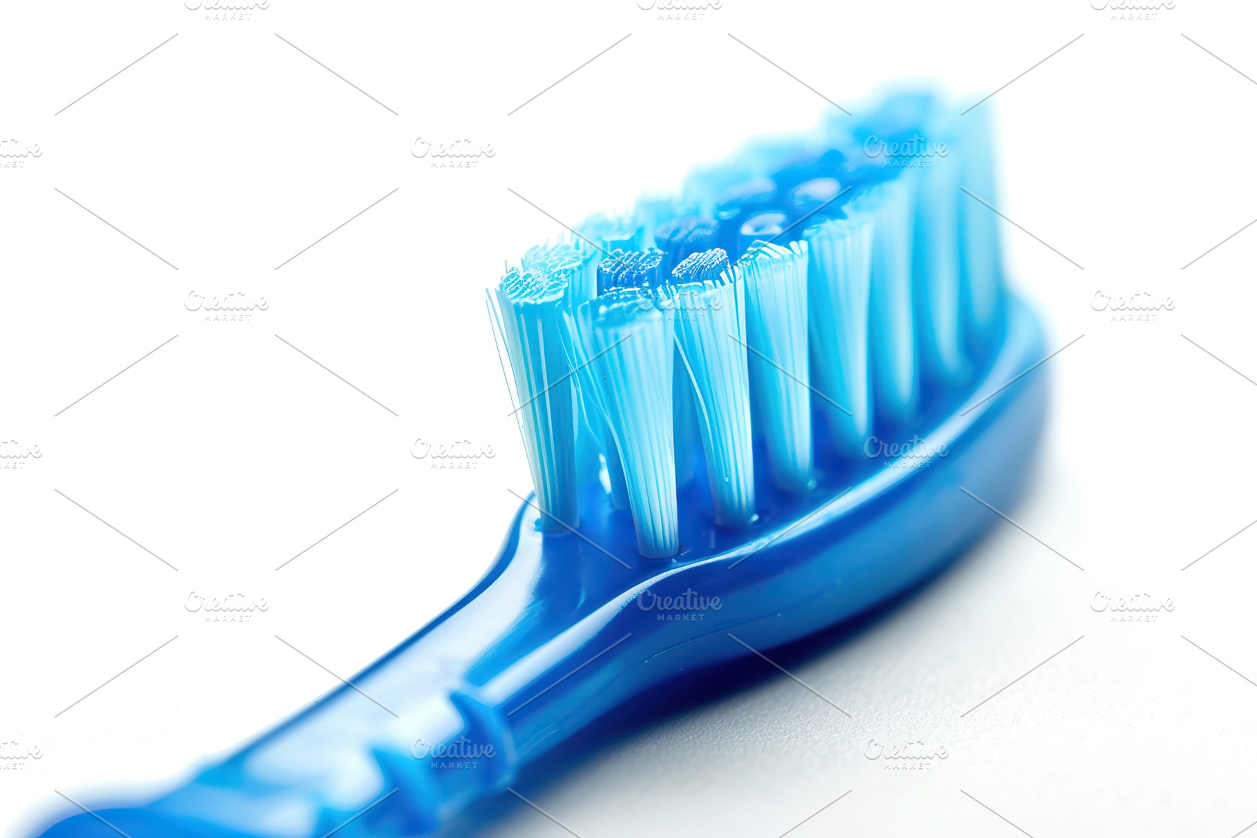 New toothbrush on white background, a Health & Medical Photo by AlyaAnd