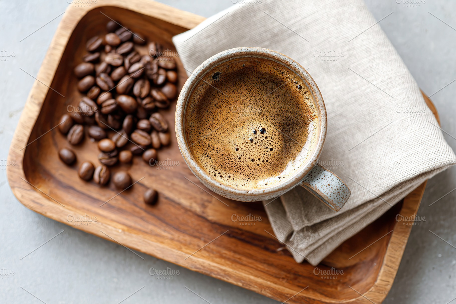 Freshly brewed coffee served in a handmade cup with roasted beans on a wooden t, a Food & Drink Photo by AlyaAnd