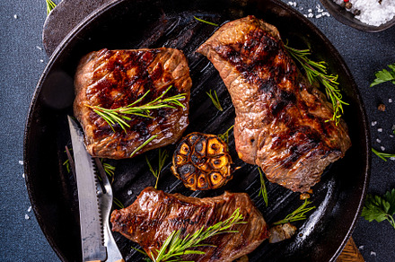 Grilled beef steak with herb and spices, a Food & Drink Photo by Rimma