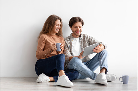 Smiling european millennial couple, a Technology Photo by Prostock-Studio