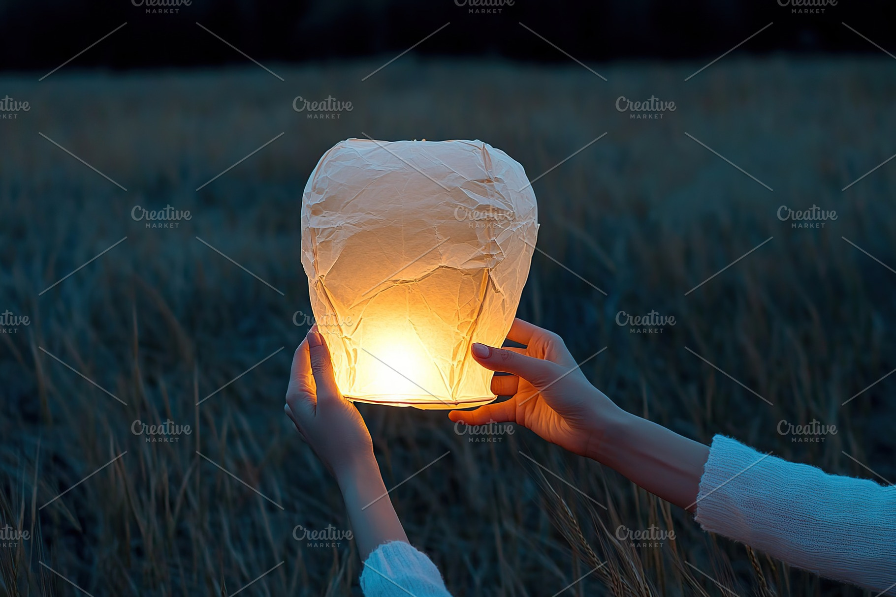 Female hands launching paper lantern into the sky, an Abstract Photo by AlyaAnd