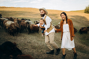 Happy family on a sheep farm