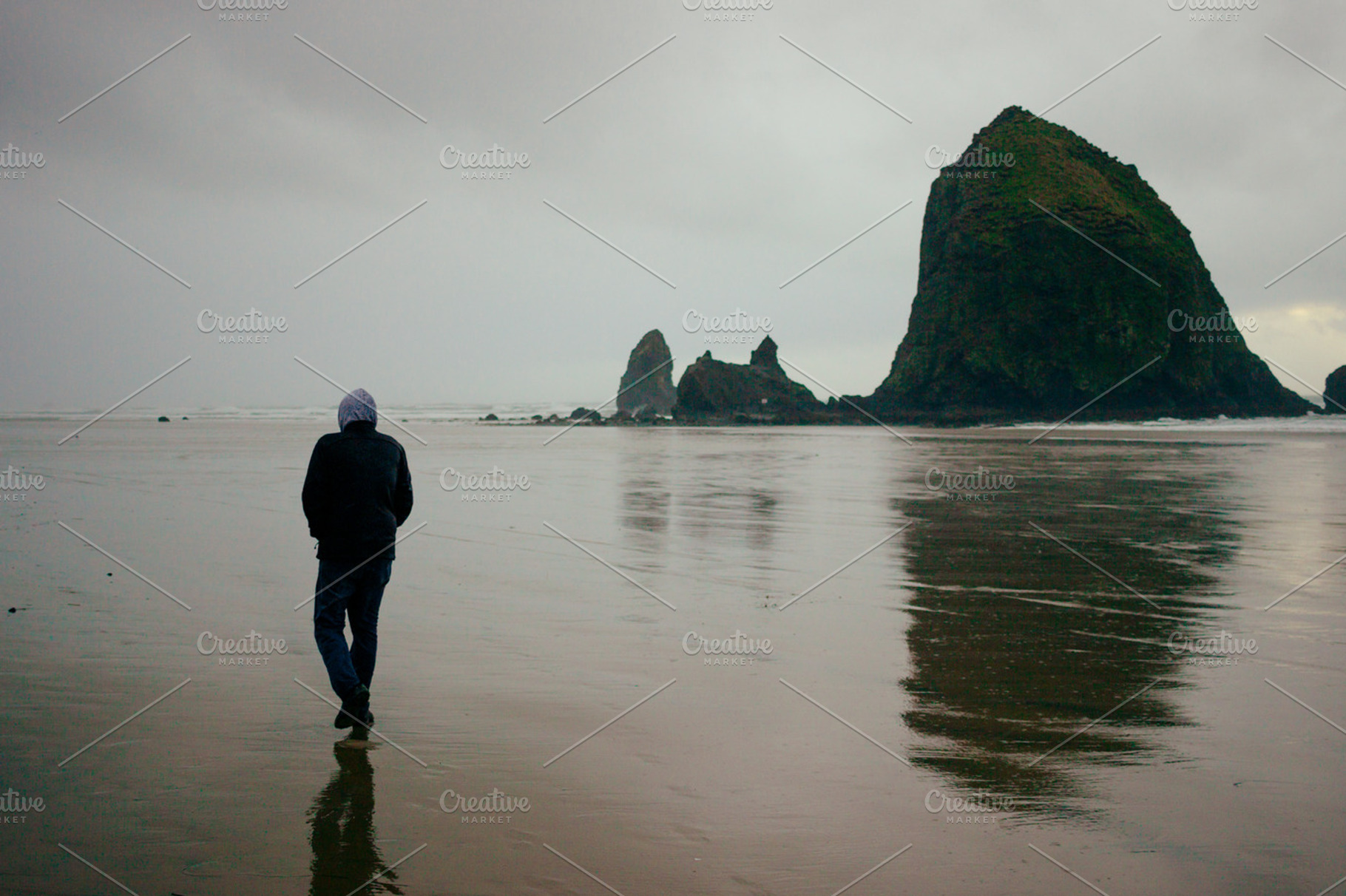 A Man Walking on the Beach, a Nature Photo by Hello Goodbye Studio
