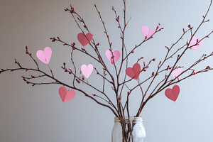 Heart decorations on tree branches, a Photo by Beautiful things