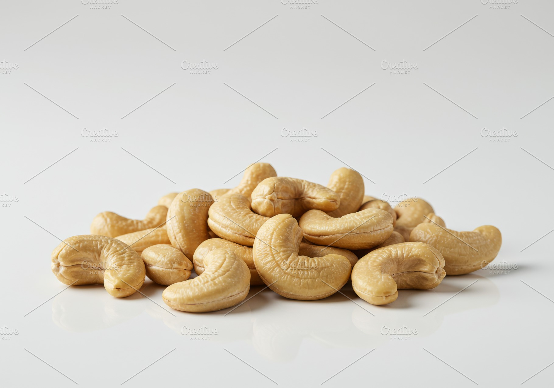 Heap of raw cashew nuts on a clean w, a Food & Drink Photo by professorinc