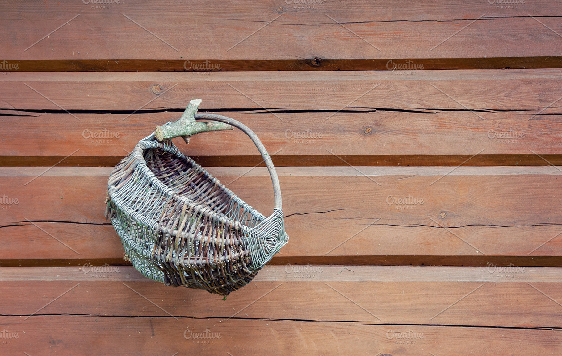 Wicker basket on wooden wall, an Industrial Photo by BOOCYS
