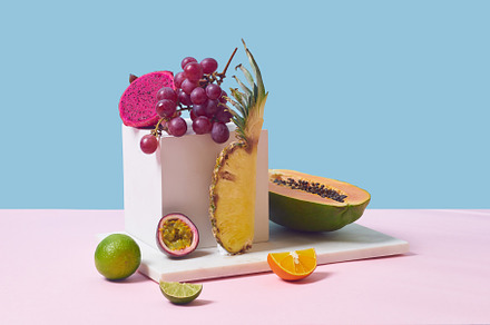 Tropical fruits variety on a colorful background. Side view with