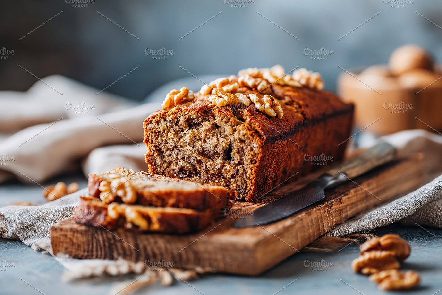 Delicious banana bread loaf sliced on a wooden board, showcasing texture and wa, a Food & Drink Photo by AlyaAnd