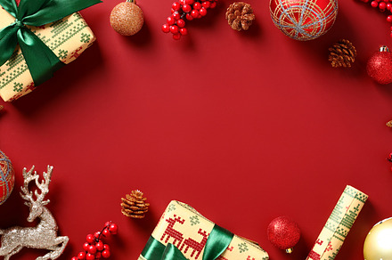 Vintage Christmas background with gifts, Xmas decorations, baubles on red table, a Holiday Photo by photoguns