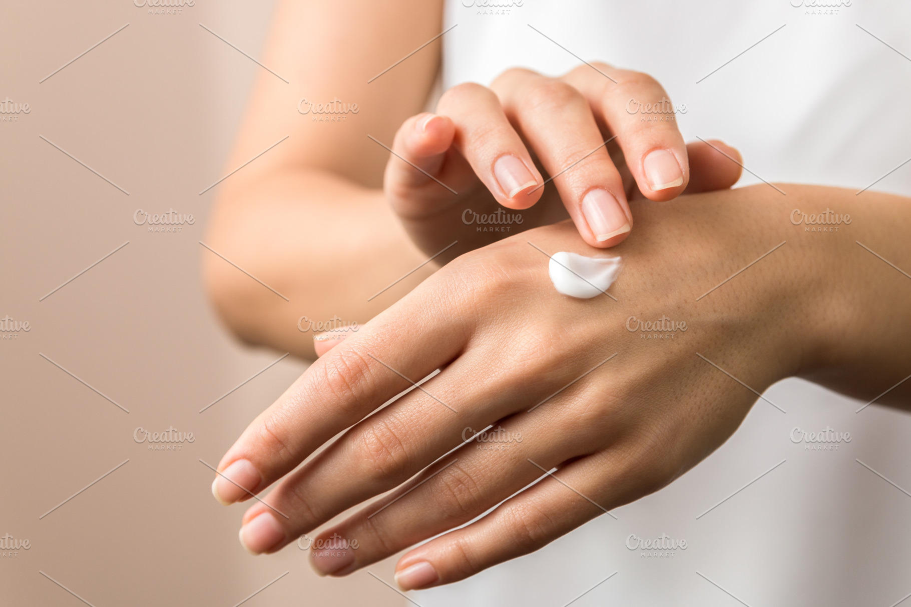 Closeup view of woman hands applying stock photo containing beautiful and, a Person Photo by AD Stock Images