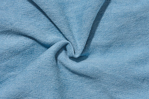 Close-up of the texture of thin light blue denim jeans, an Abstract Photo by ndanko