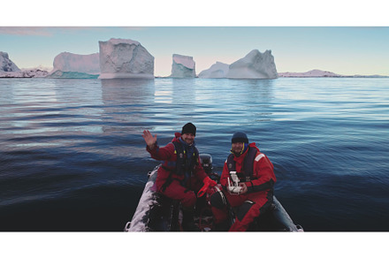 Two man in zodiac boat enjoy