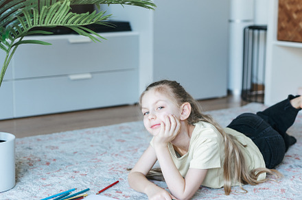 Child girl drawing with colorful pencils, an Arts & Entertainment Photo by Olena Rudo