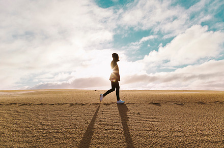 Sand dunes at sundown containing sand dunes, girl walking, and fashion