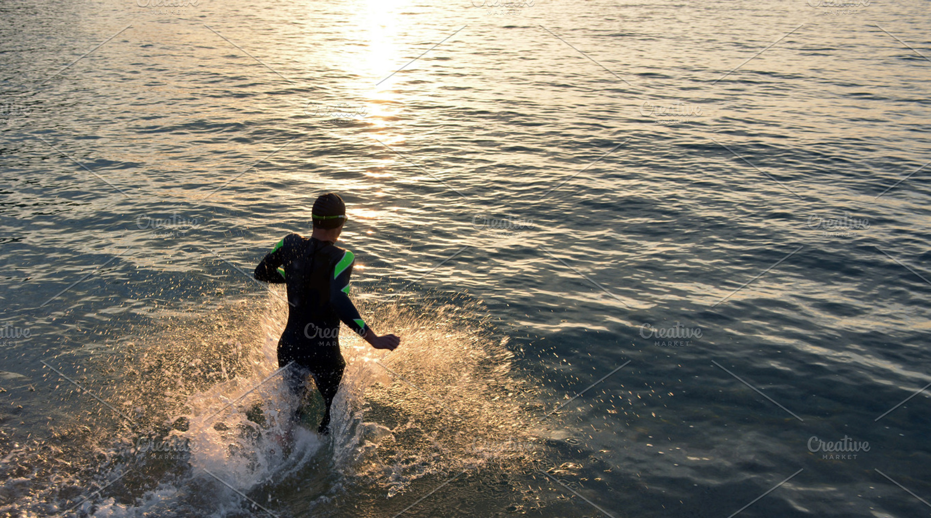 Athlete triathlon in front of a sunr stock photo containing triathlon and, a Sports & Recreation Photo by expressiovisual