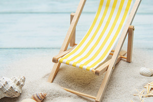 Miniature deck chair on sandy beach with seashells inviting rela, a Holiday Photo by Olena Rudo