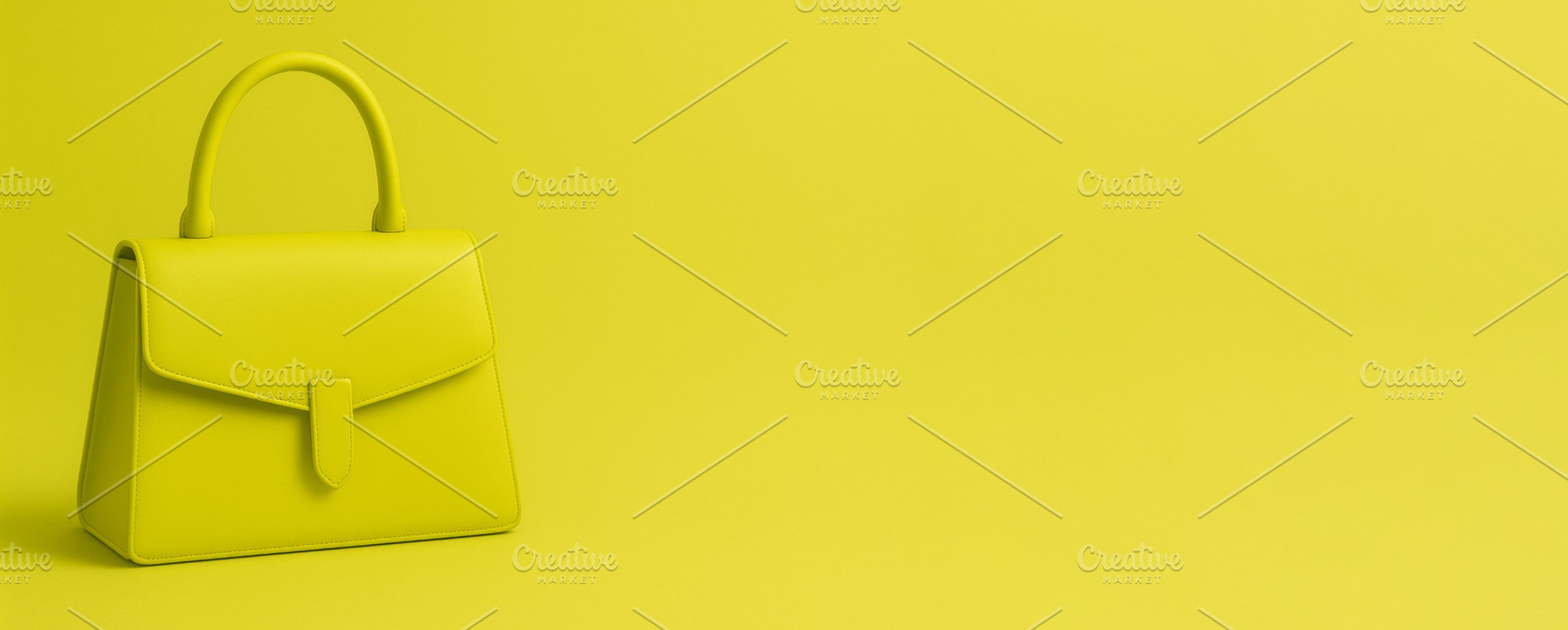 Chartreuse handbag on lime background showcasing fashion accesso, a Photo by Dvoevnore photos