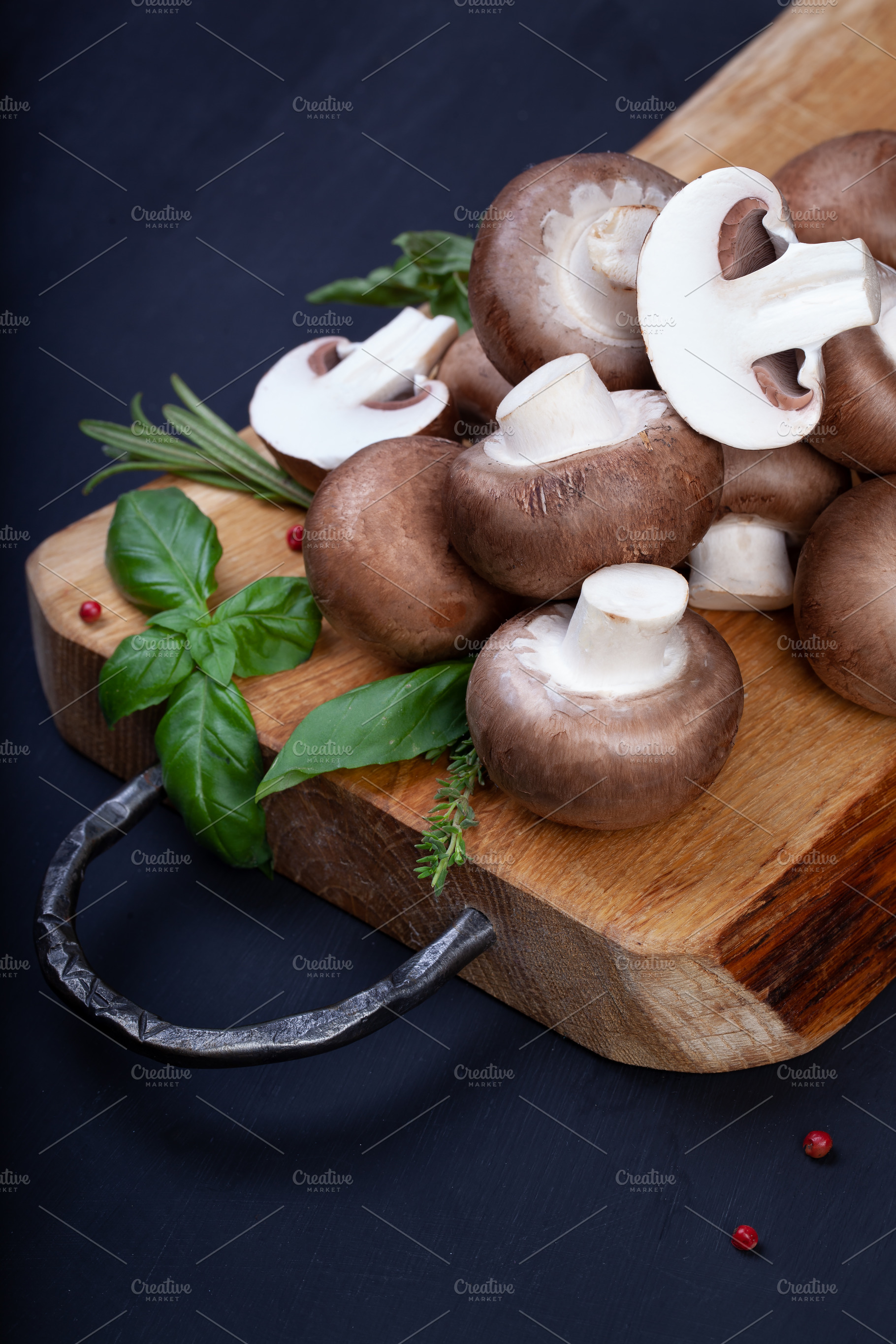 Fresh champignon mushrooms on wooden table, a Food & Drink Photo by eleana