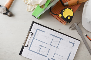 General view of architect's desk with folder with plans, an Architecture Photo by Davizro's Market