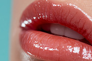 Close up of a woman's full lips applying shiny pink lip gloss, h, a Beauty & Fashion Photo by Studio ANNA (Thumbnail 1 of 2)