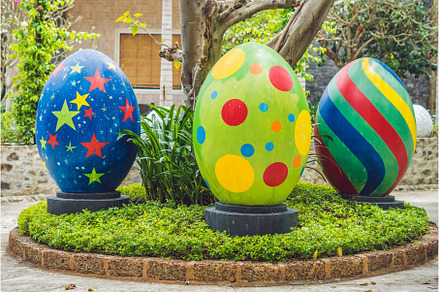 Multicolored eggs in the grass, a Holiday Photo by Elizaveta Galitskaya
