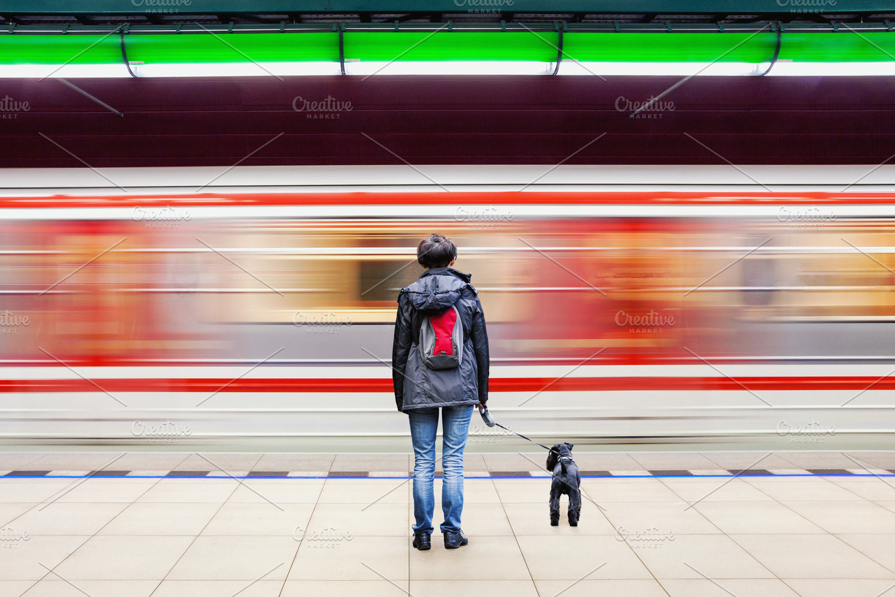 Woman with dog at subway station, a Person Photo by BOOCYS