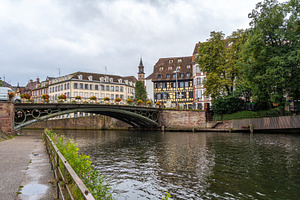 Iron bridge and colorful houses on the Ill river Strasbourg, Fra, an Architecture Photo by GoodGoods