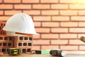 Masonry materials and tools and brick wall background behind, an Architecture Photo by Davizro's Market