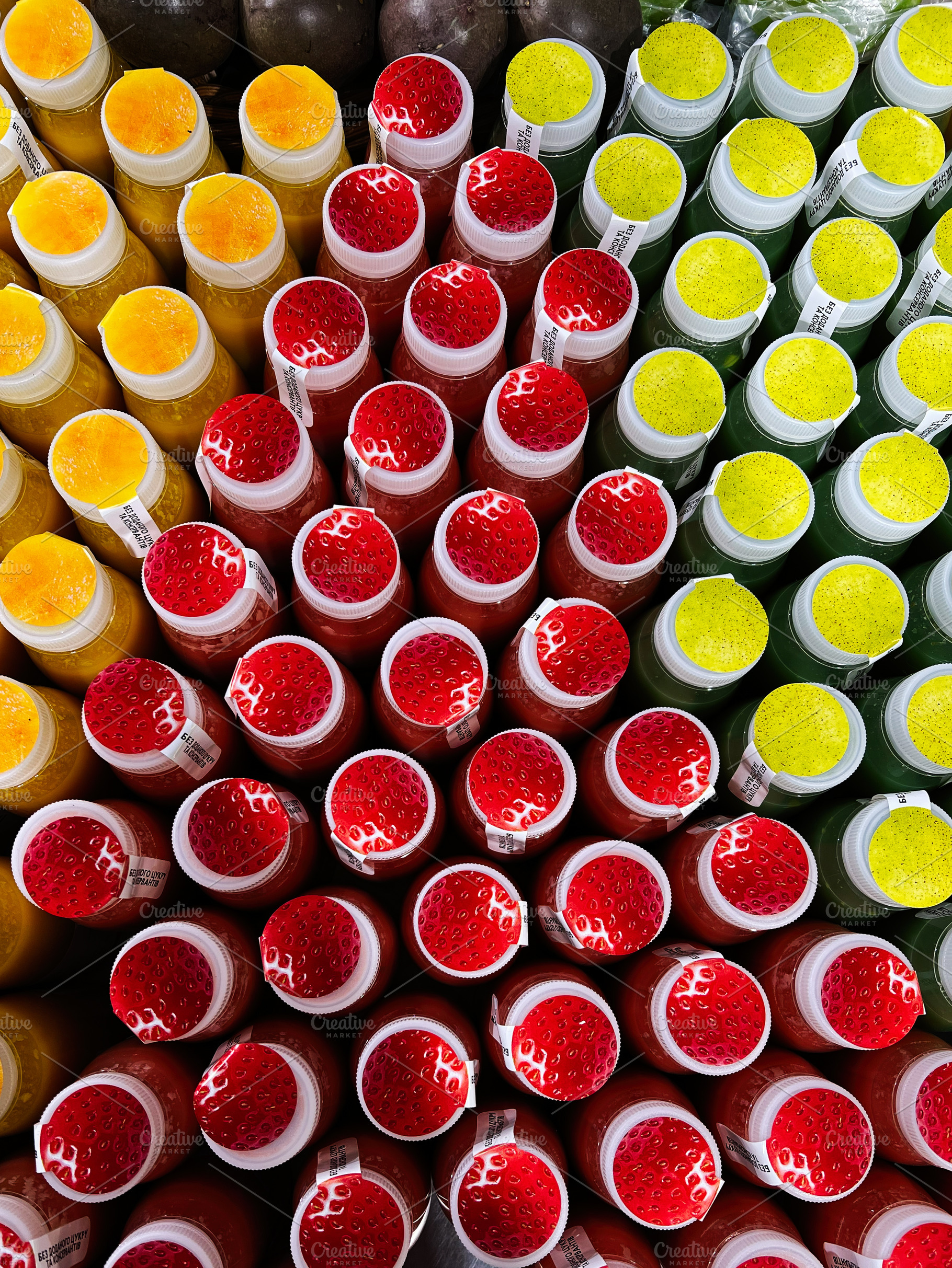 Rows of colorful bottled beverages in an attractive symmetrical arrangement, a Photo by AS photostudio