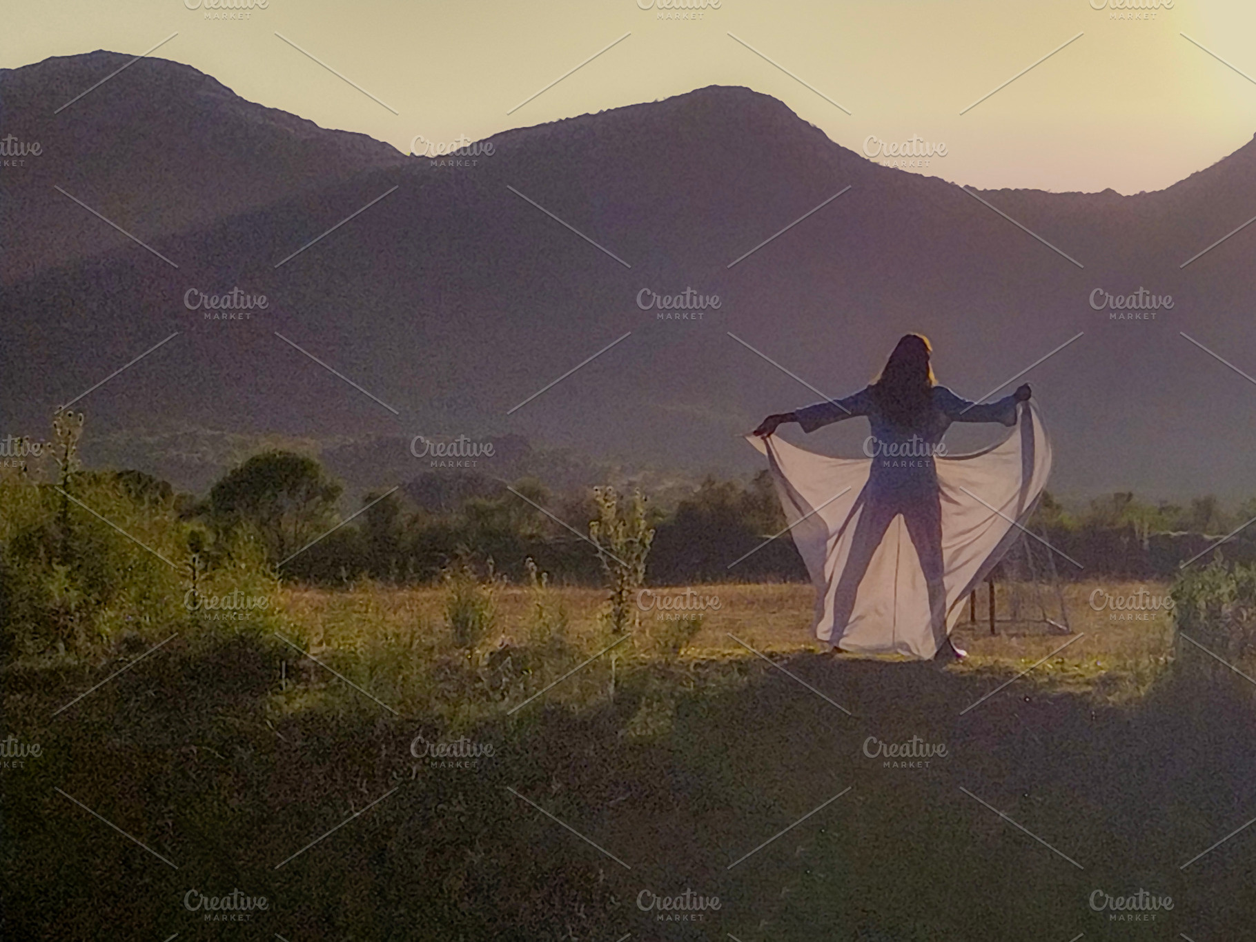 Woman in nature at sunrise expressing freedom, an Arts & Entertainment Photo by DanFLCreativo