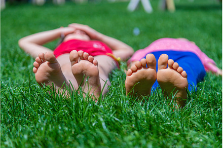 Children's feet on the grass, a Nature Photo by yanadjana