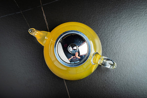 Fruit tea with mango and mint in a glass teapot on the table, a Food & Drink Photo by Budarinphoto