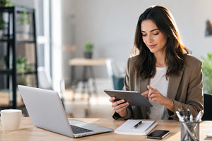 Woman working in a modern office, a Photo by Beautiful things