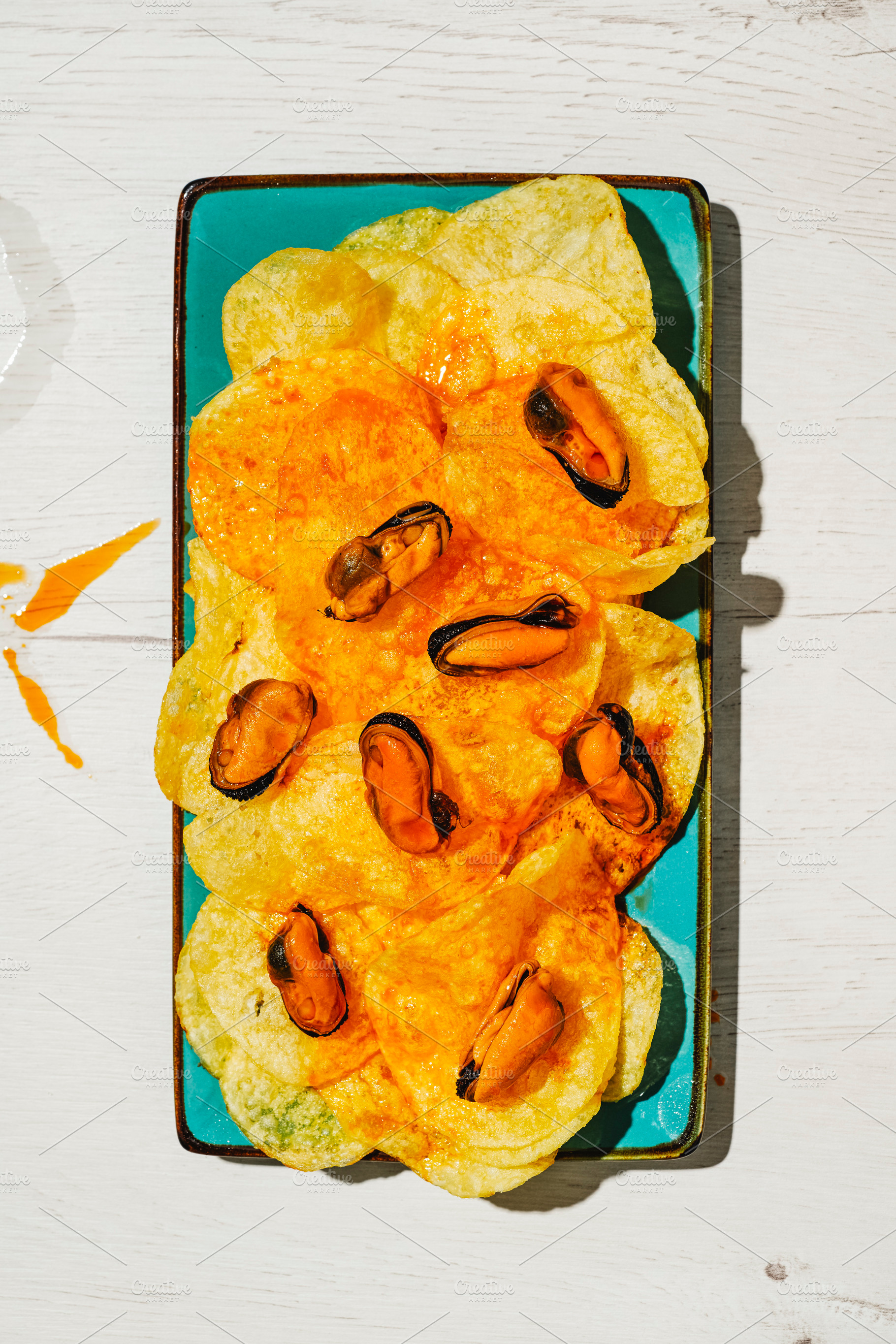 mussels and chips coated with escabeche sauce, a Photo by Nito