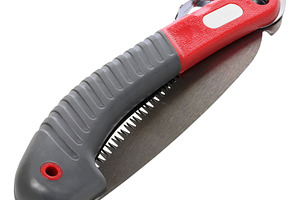 Folding wood saw on an isolated background, an Industrial Photo by ndanko