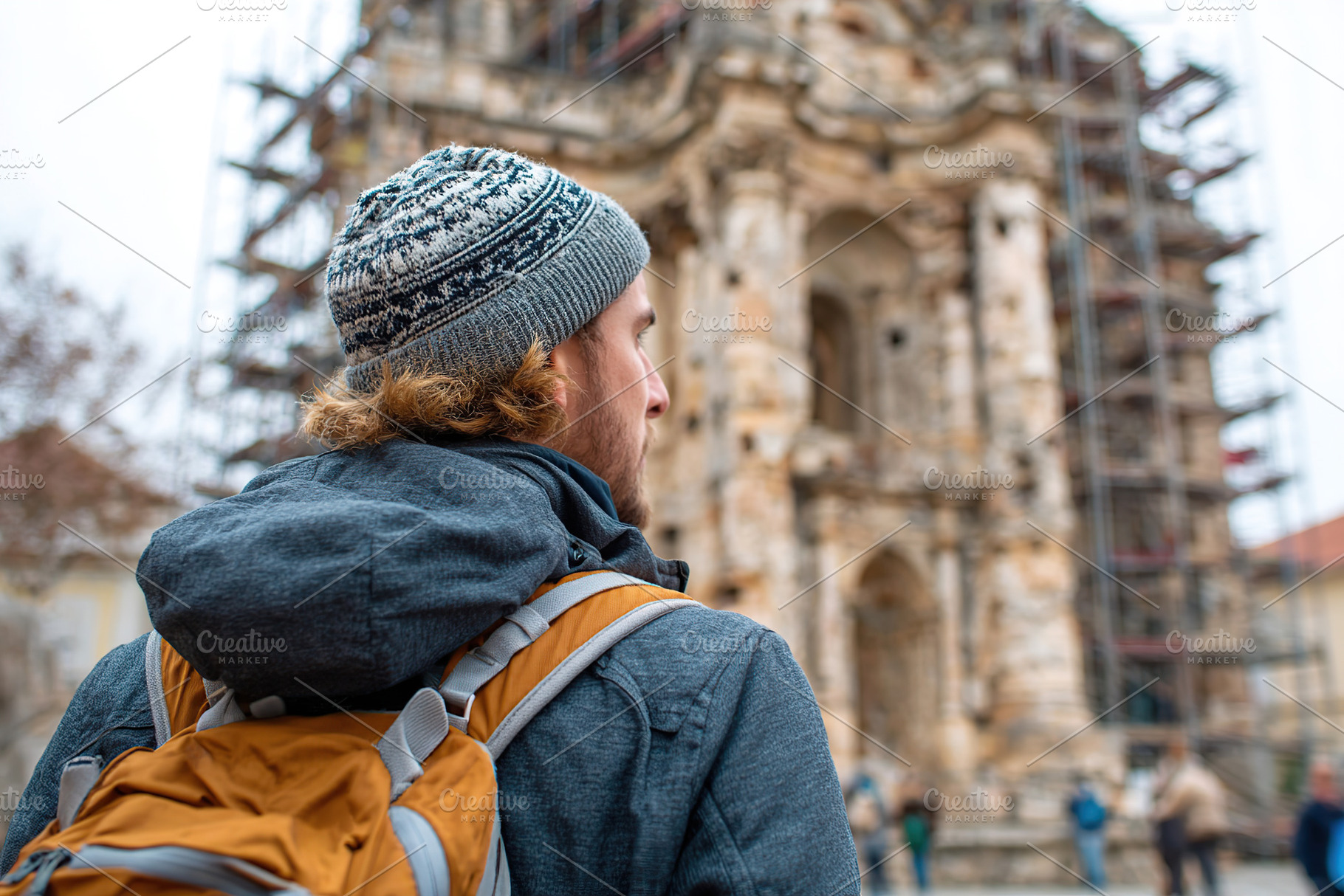 Exploring a historic monument under renovation with a travel enthusiast, a Person Photo by AlyaAnd