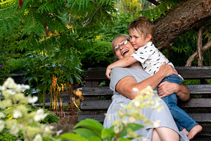 Grandmother hugging grandson happily, a Person Photo by Elena Vagengeim