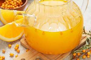 Warming sea buckthorn tea with orange slices and honey, a Food & Drink Photo by Olena Rudo