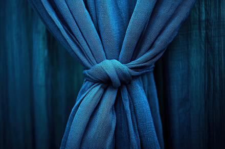 Closeup of a tied blue curtain with, a Photo by Iftikhar Alam
