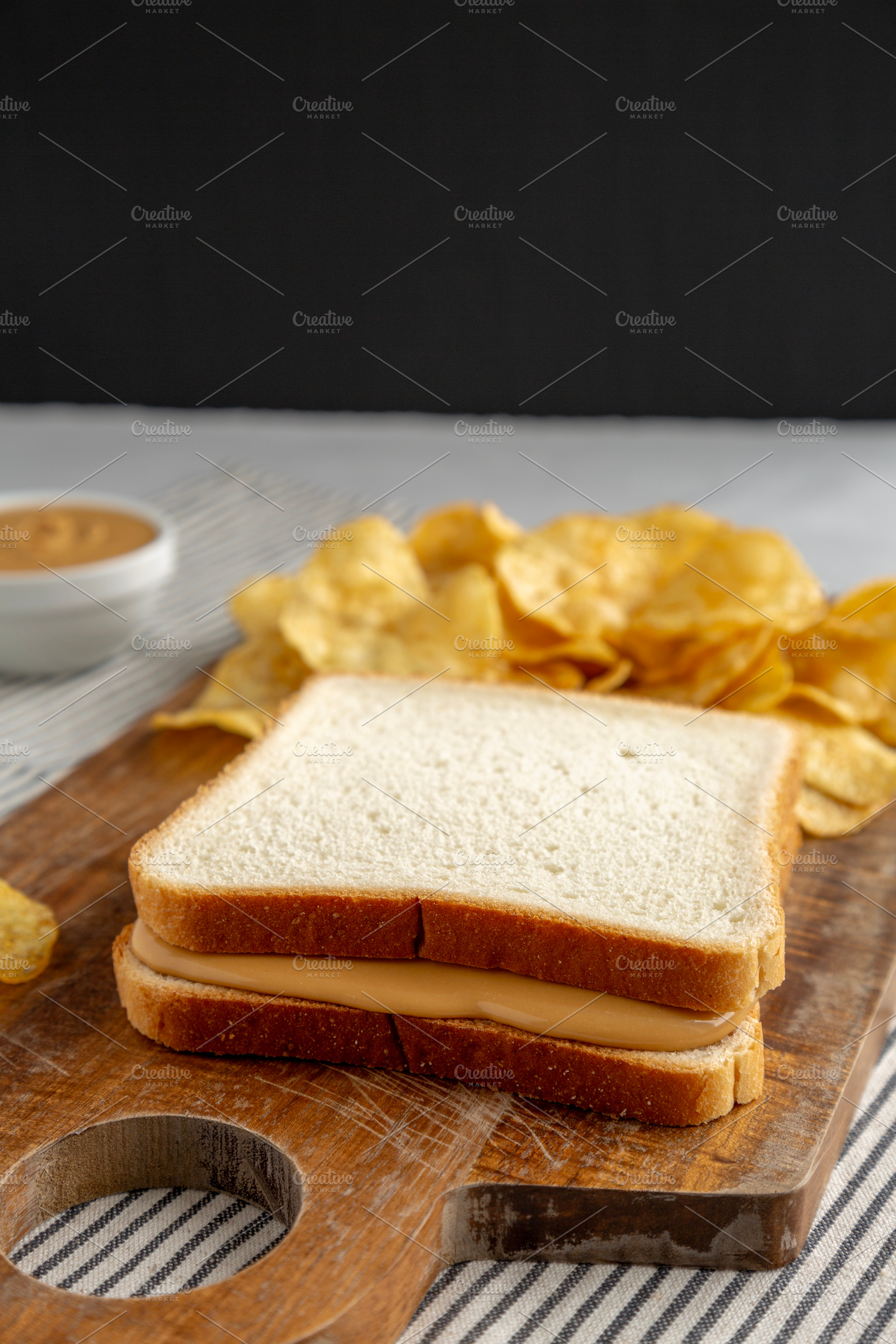 Homemade American Peanut Butter Sandwich on a Wooden Board, side, a Food & Drink Photo by LiudmylaChuhunova