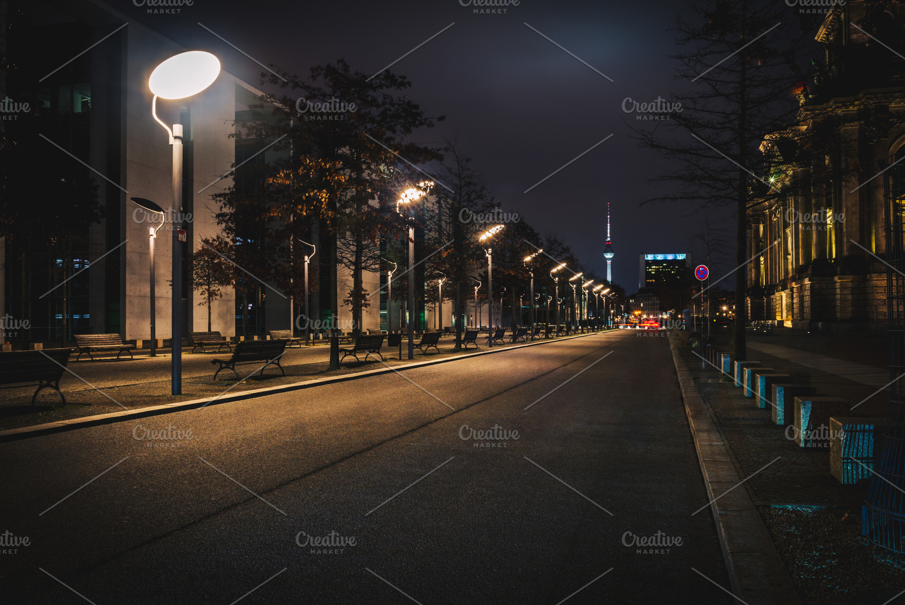 Long empty city street at night, an Architecture Photo by Juicy Photography