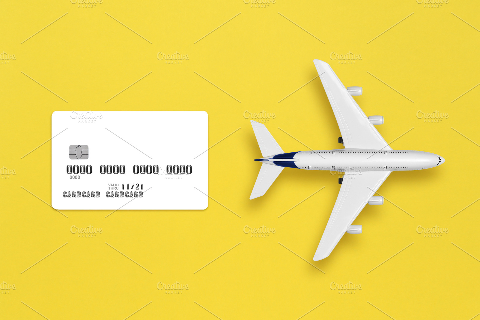 Model of airplane and credit card, a Transportation Photo by Anatoliy Sadovskiy
