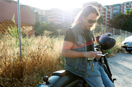 Young man wearing sunglasses on a chopper motorcycle, a Person Photo by 2Design