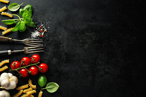 Italian food background with ingredi containing gastronomy, dark background