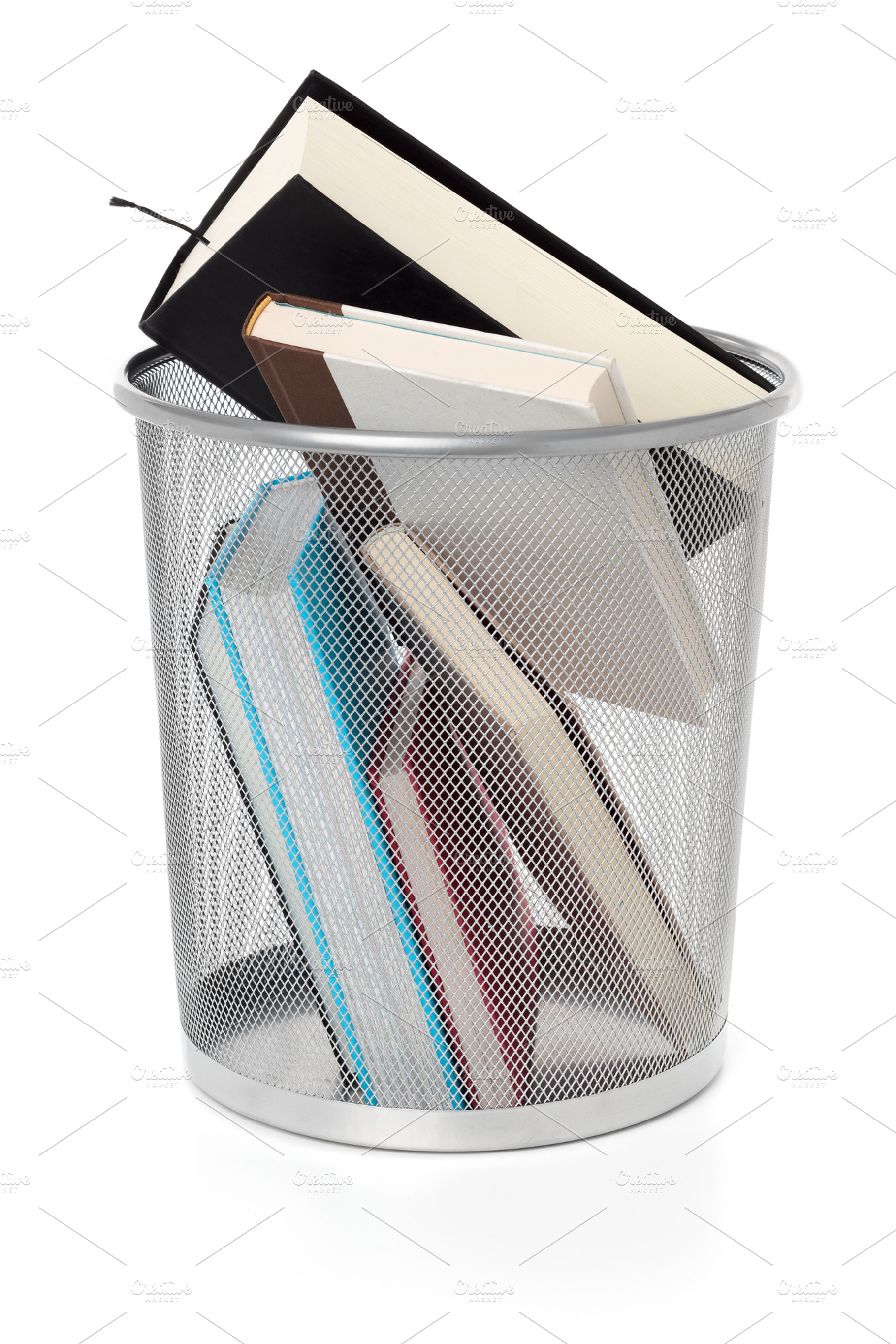 Books on a wastepaper basket, a School & Education Photo by Ernesto Solla